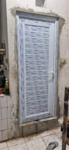 Pintu Swing UPVC Panel Ekonomis Yogyakarta